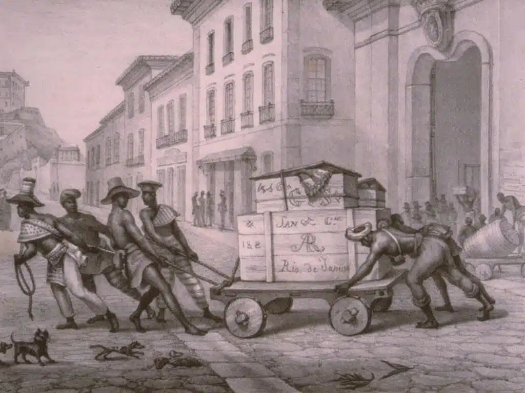 Carregadores de caixas de açúcar. Jean Baptiste Debret, Voyage Pittoresque et Historique au Bresil (Paris, 1834-39) Carregadores de caixas de açúcar. Jean Baptiste Debret, Voyage Pittoresque et Historique au Bresil (Paris, 1834-39). O açúcar era, desde o século XVI, embalado em caixas de madeira, as quais eram marcadas com ferros. As marcas, elaboradas por artesãos especialistas nesta atividade, eram específicas de cada engenho.